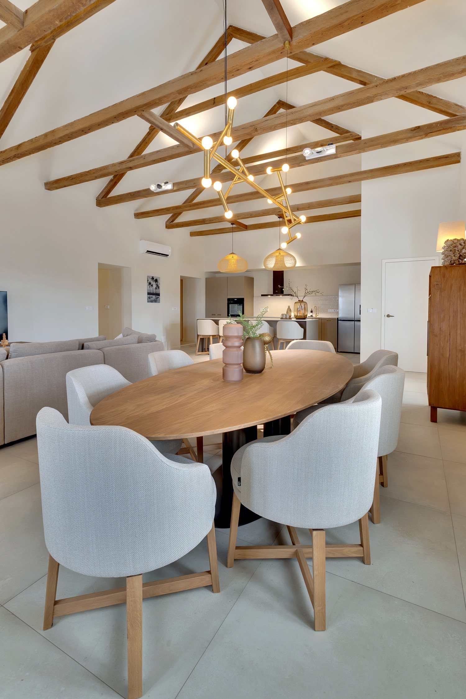Dining table beneath a timber ceiling at Kaya Grandi 49