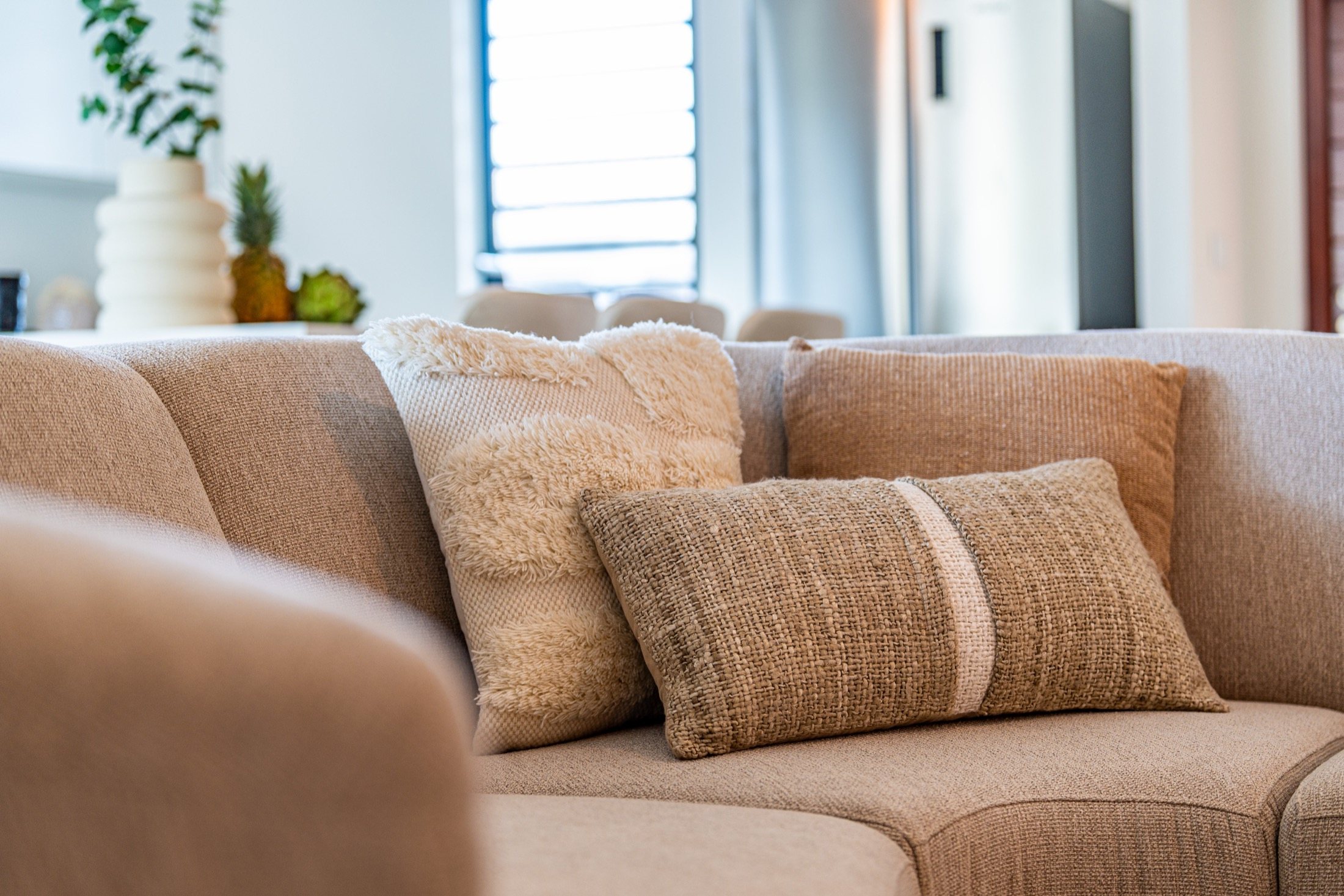 Natural cushions on a soft sofa